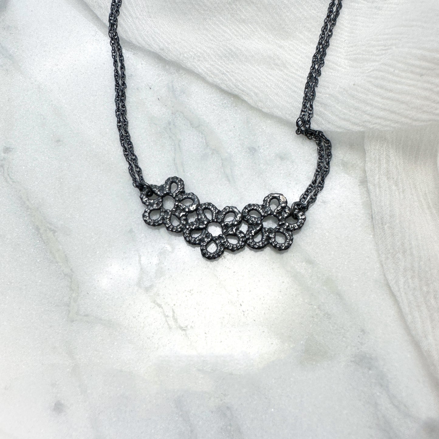 Forget-me-not trilogy necklace in oxidised silver