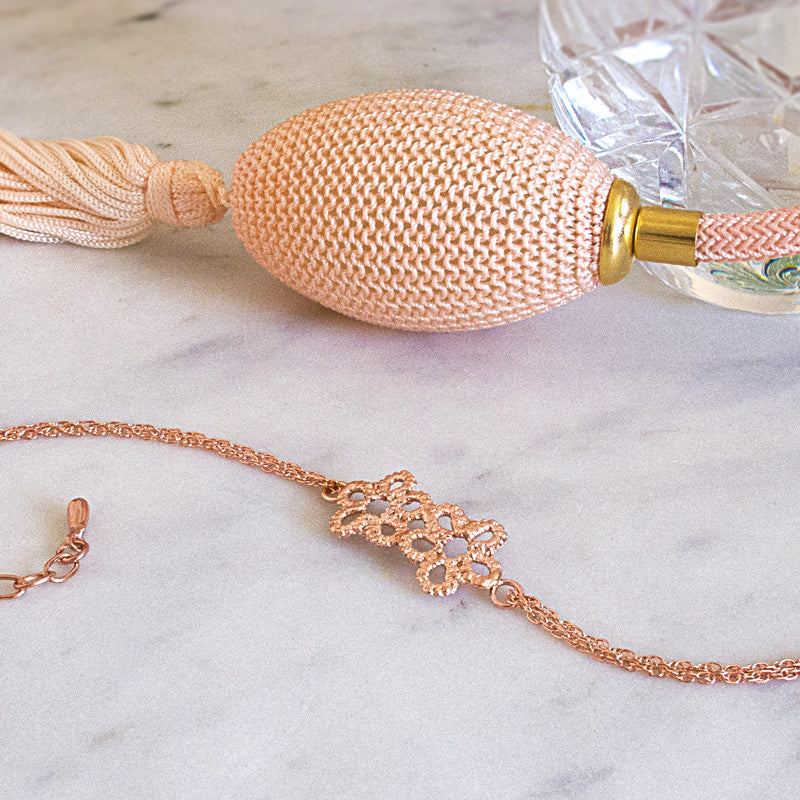 rose gold forget me not flower bracelet with perfume bottle